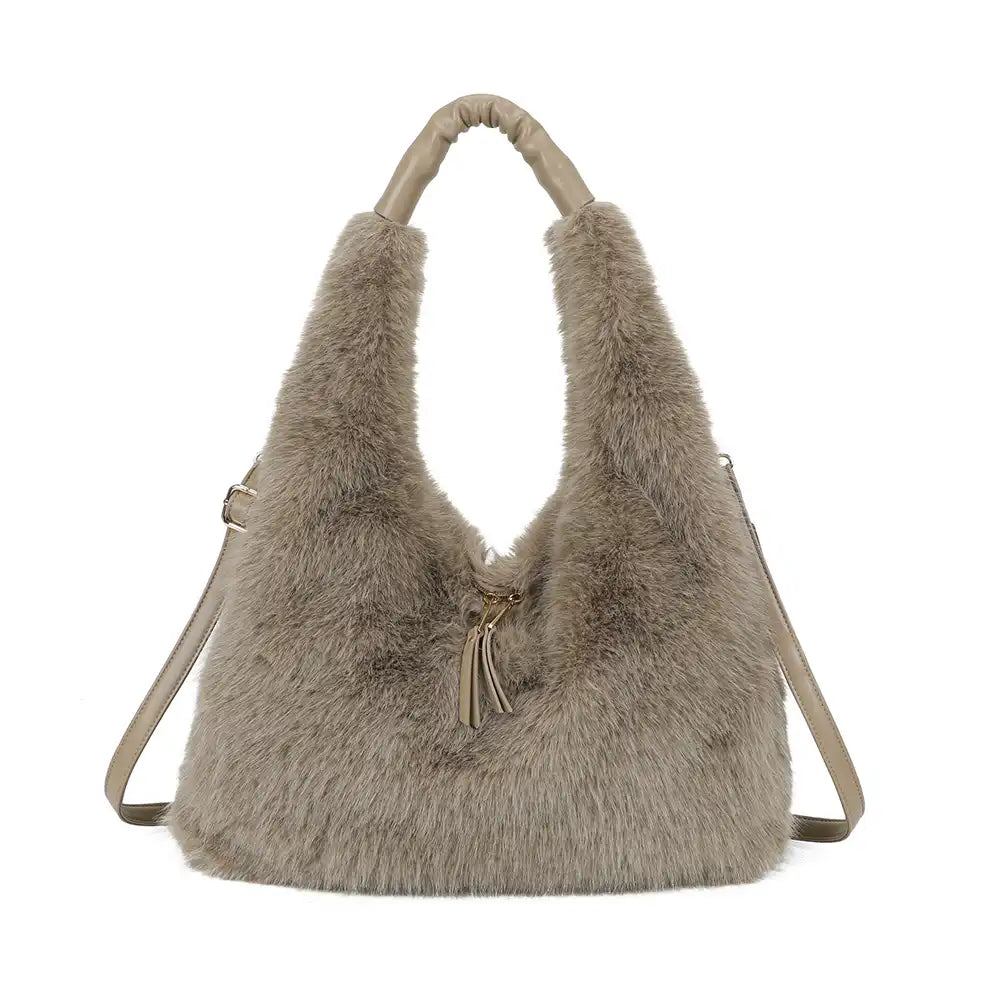A taupe faux fur hobo shoulder bag with a matching faux fur handle and a thin shoulder strap, shown against a plain white background.