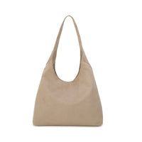 A light beige suede hobo shoulder bag with a single strap, shown against a plain white background.