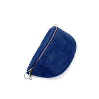 Half moon shaped bag in a suede blue. Zip fastening over the top with silver hardware. 