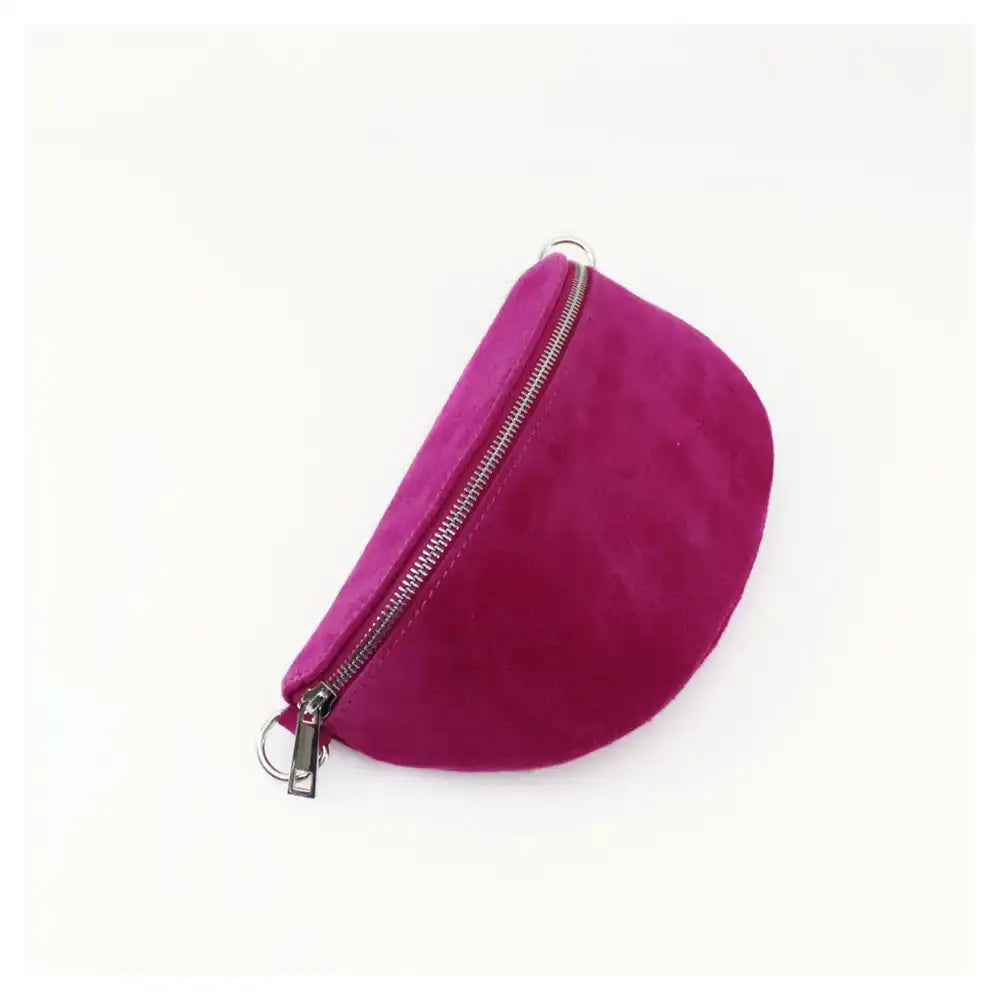 Half moon shaped bag in a suede Fuchsia. Zip fastening over the top with silver hardware. 