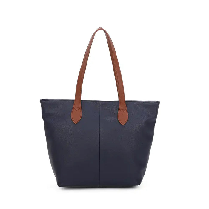 Navy tote bag with tan brown shoulder straps. On a white background.