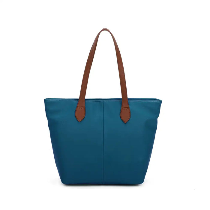 Teal tote bag with tan brown shoulder straps. On a white background.