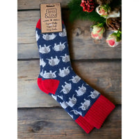 Blue background sock with a red ribbed ankle cuff, heel and toe area. Featuring grey elephants.