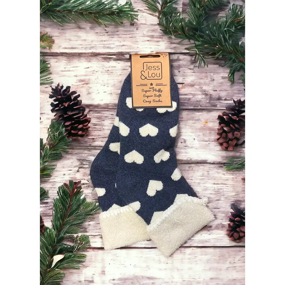 Navy blue background sock with cream hearts and a turned down cream ankle cuff