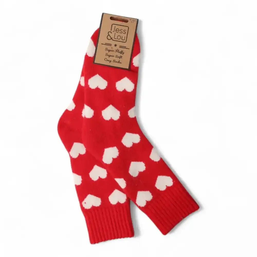 Red socks with a ribbed cuff and white hearts on it. 