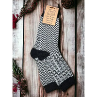 Herringbone black and white sock with black toe, heel and ribbed ankle cuff. 