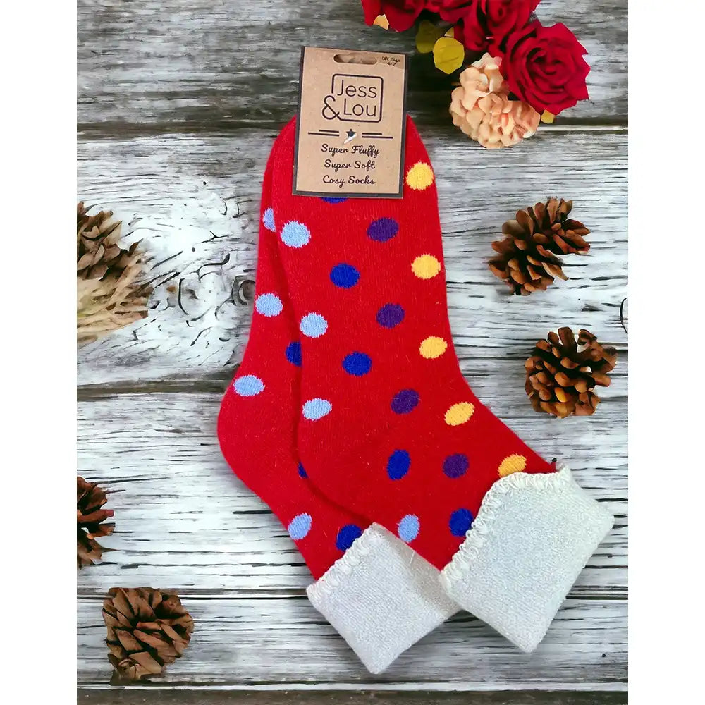 Fire engine red background socks with multi coloured spots and a turned down cream ankle cuff