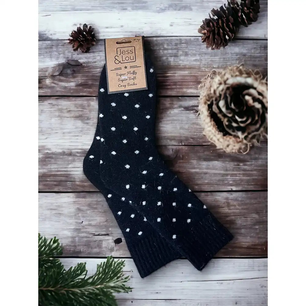 Black socks with a ribbed ankle cuff and small white dots. 