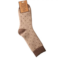 Beige coloured socks with a brown toe, heel and ribbed ankle cuff. Brown spots all over. 