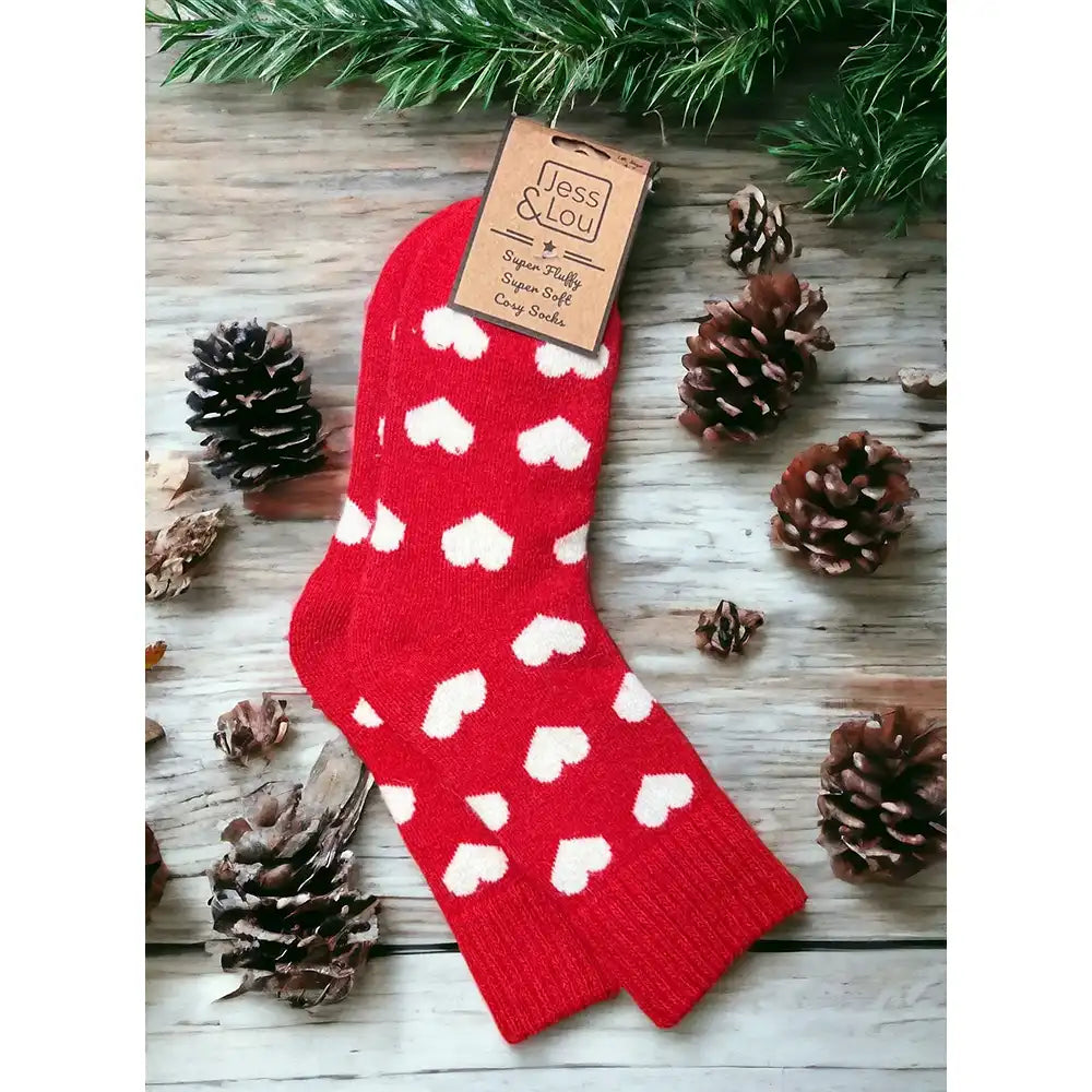 Red background sock with large white hearts and ribbed ankle cuff