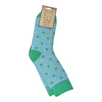 Green star patterned ankle socks with 'Jess & Lou' packaging on a white background