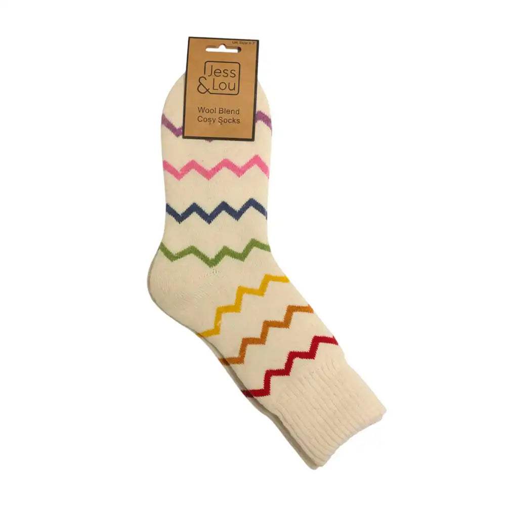 A single cream-colored knit sock with colorful zigzag stripes in pink, navy, green, yellow, orange, and red, featuring a cardboard hanger tag that reads 'Jess & Lou'.