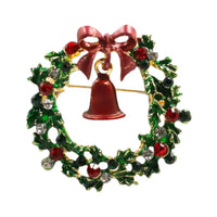 Christmas wreath brooch with a red bell and bow on a white background