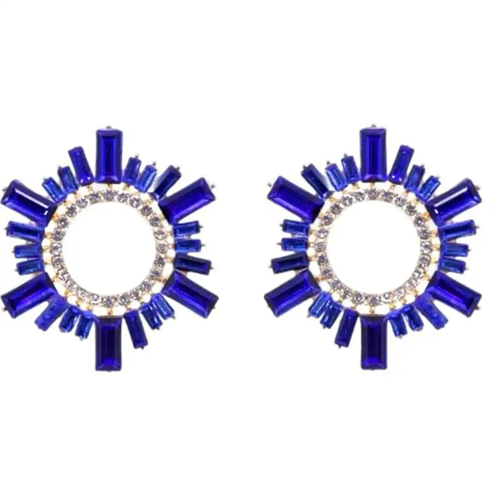 Pair of blue circular earrings with gemstone accents on a white background