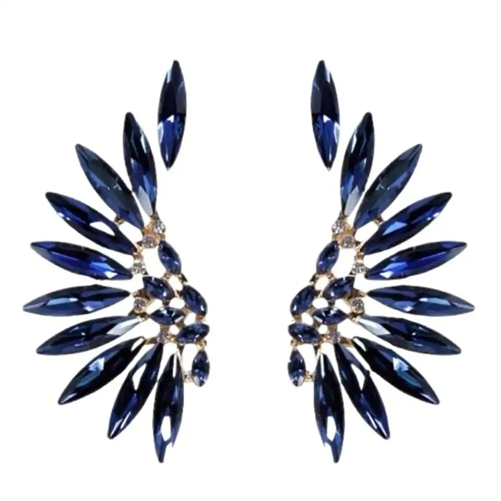 Pair of blue gemstone earrings on a white background