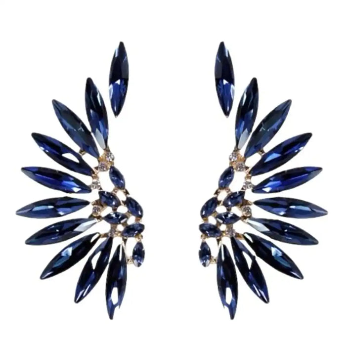 Pair of blue gemstone earrings on a white background