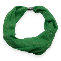 Green infinity scarf with glittery specks on a white background