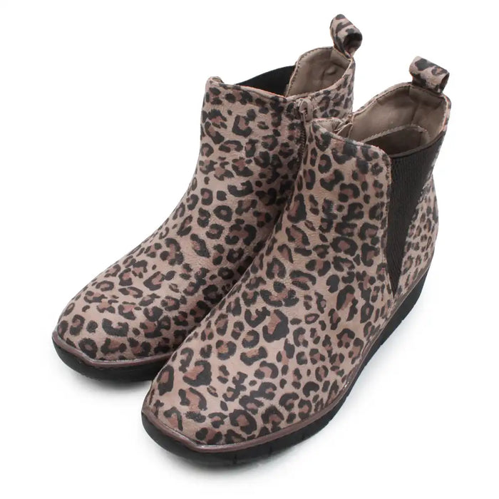 A pair of women's ankle boots featuring a brown and beige leopard print pattern, designed with black side elastic panels and pull tabs, shown on a white background.