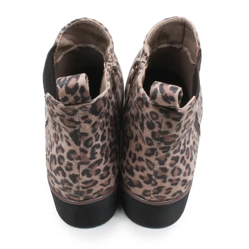 A pair of women's ankle boots featuring a brown and beige leopard print pattern with black soles, shown from a top-down view on a white background.
