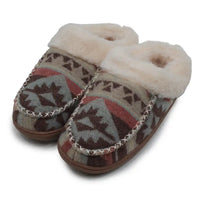 A pair of slip-on moccasin-style slippers with a brown, gray, and red geometric pattern, featuring a cream-colored faux fur lining and a decorative silver-tone chain trim along the edge.