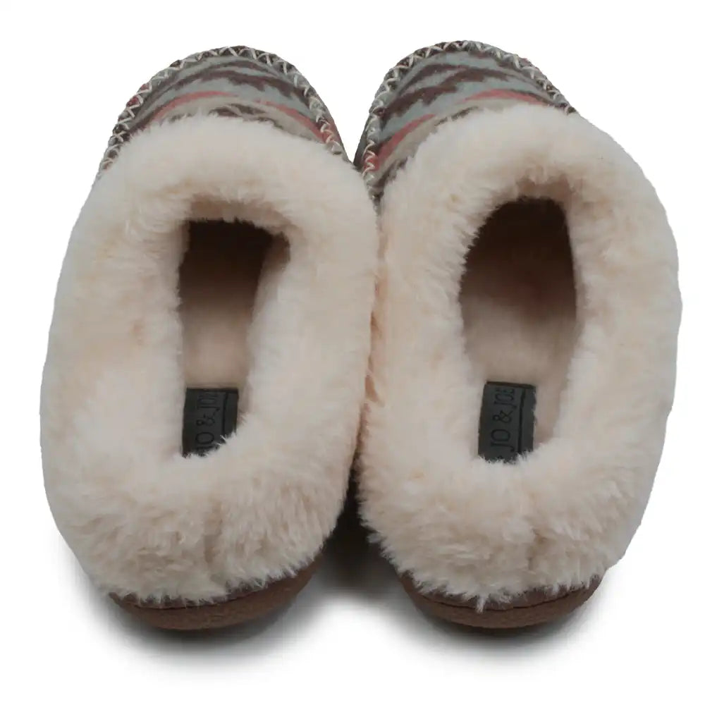 A pair of slippers with a thick cream faux-fur lining and a brown, beige, and pink patterned textile upper, shown from a top-down view on a white background.
