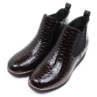 Jo and Joe mock patent crocodile Chelsea boots. Dark brown and black rubber soles. Angled view.