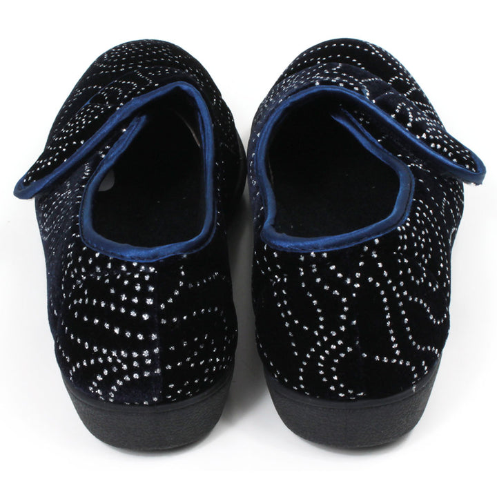 Jo and Joe navy blue full slippers with black soles, extensive small diamante patterning and wrap over Velcro fitting. Back view.