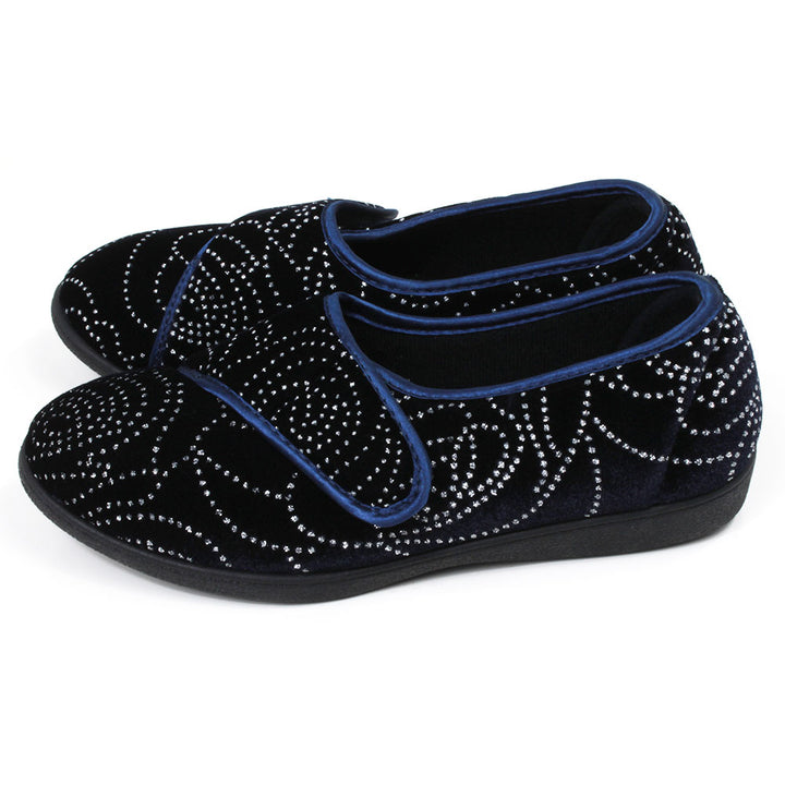 Jo and Joe navy blue full slippers with black soles, extensive small diamante patterning and wrap over Velcro fitting. Side view.
