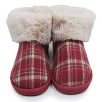 Red plaid slippers with cream furry ankle cuffs in a white studio environment.