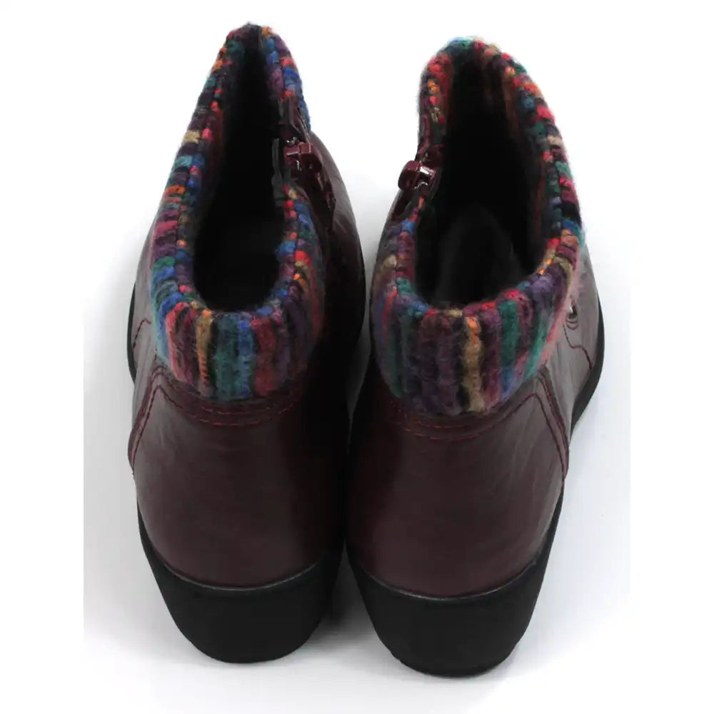 Burgundy ankle boots with knitted multicolour ankle cuffs. Zip fastening. Low  heels. Back view.