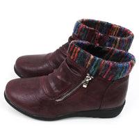 Burgundy ankle boots with knitted multicolour ankle cuffs. Zip fastening. Low  heels. Side view.