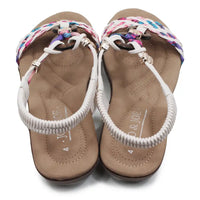 Pair of sandals with colorful straps on a white background