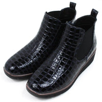 Mock croc navy blue Chelsea boots. Low heels. Angled view.