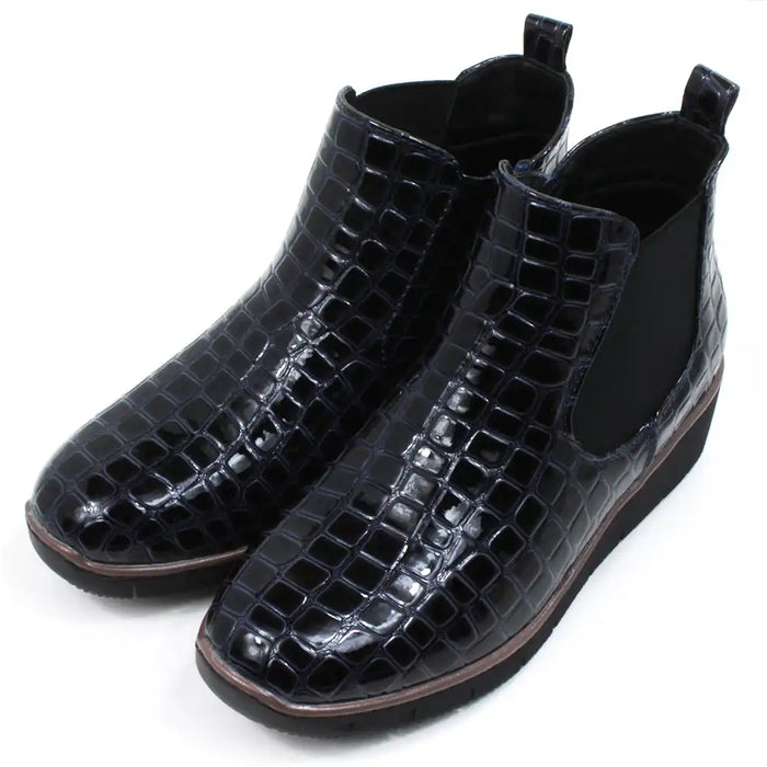 Mock croc navy blue Chelsea boots. Low heels. Angled view.