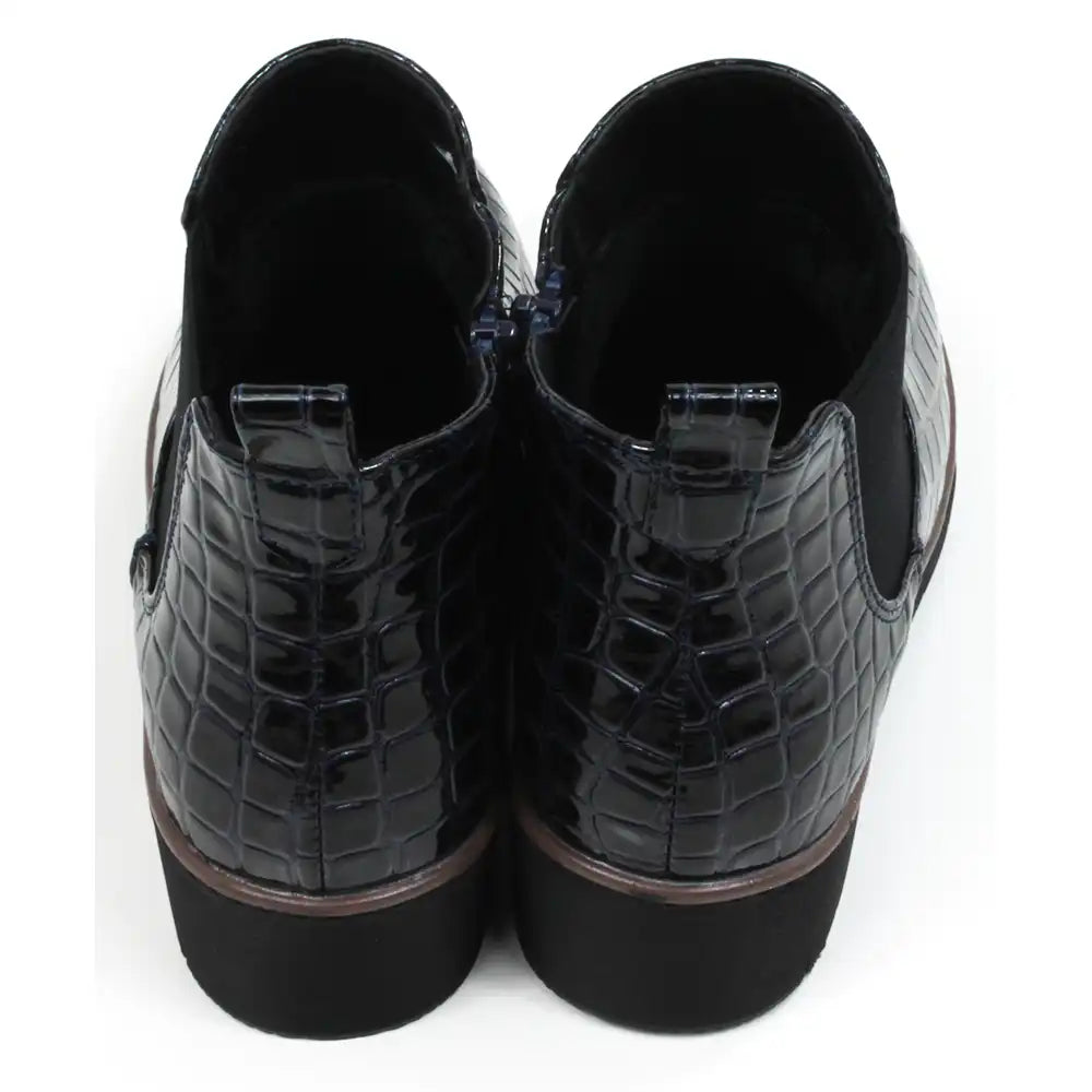 Mock croc navy blue Chelsea boots. Low heels. Back view.