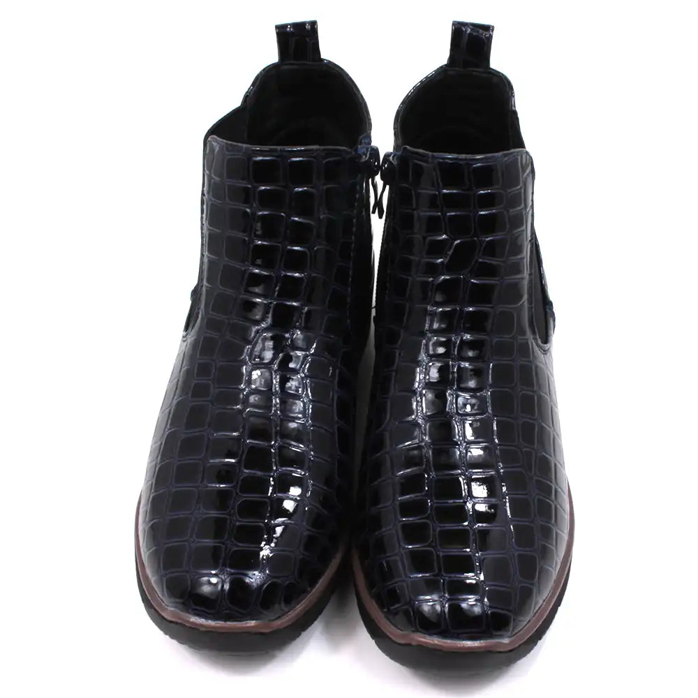 Mock croc navy blue Chelsea boots. Low heels. Front view.