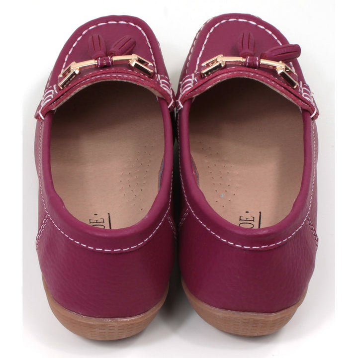 Jo and Joe Nautical mocassin style slip on shoes in fuchsia. Gold bar and tassels details on foot. Back view