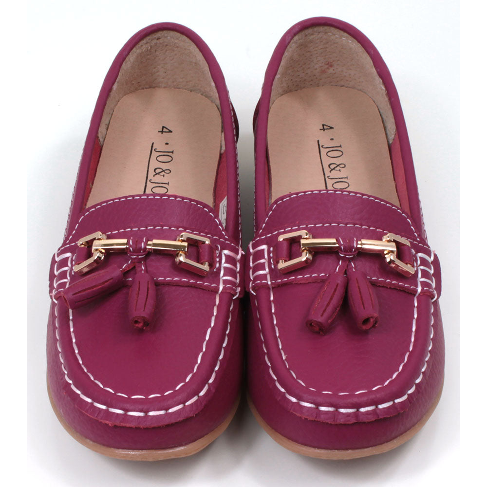 Jo and Joe Nautical mocassin style slip on shoes in fuchsia. Gold bar and tassels details on foot. Front view