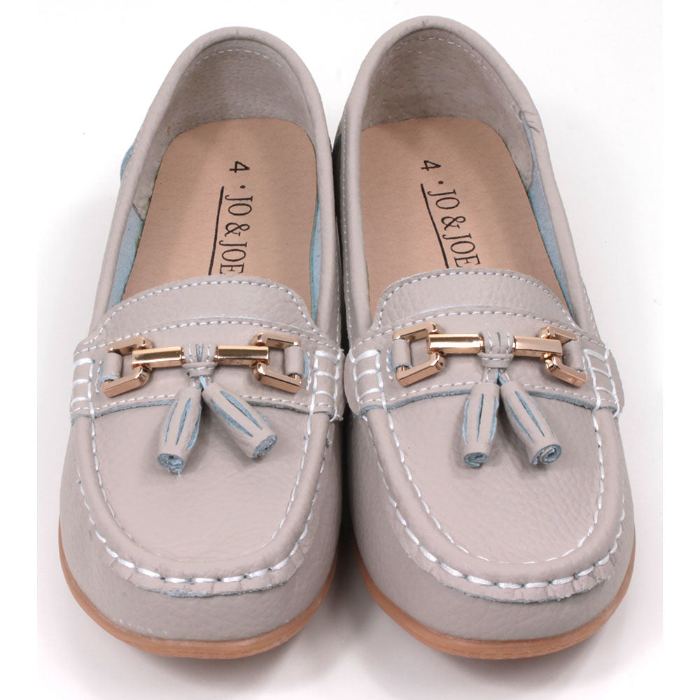 Jo and Joe Nautical mocassin style slip on shoes in smoke. Gold bar and tassels details on foot. Front view