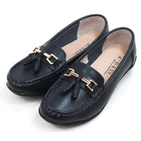 Pair of navy blue loafers with gold accents. Angled view.