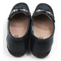 Pair of navy blue loafers with gold accents. Back view.