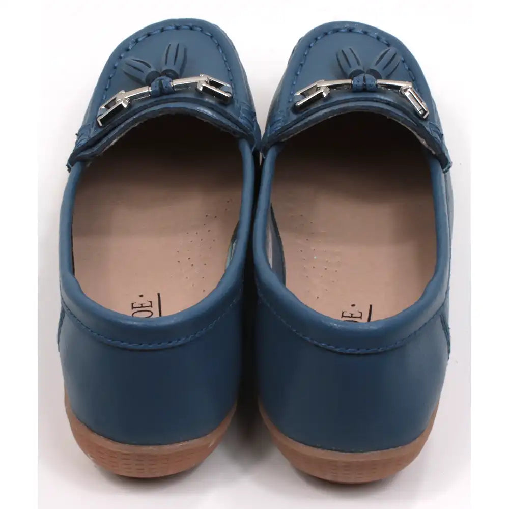 Joe and Jo moccasin style slip on, leather shoes in china blue colour. Over the foot metallic gold coloured  detail and two matching tassels. Beige rubber soles. Back view.