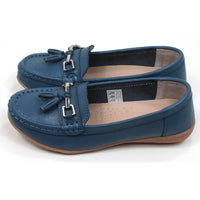 Joe and Jo moccasin style slip on, leather shoes in china blue colour. Over the foot metallic gold coloured  detail and two matching tassels. Beige rubber soles. Side view.