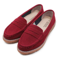 Red loafers on a white background