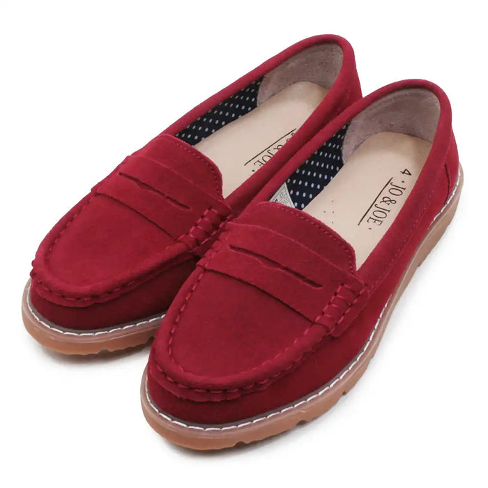 Red loafers on a white background