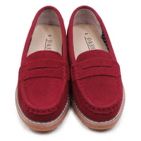 Pair of red loafers on a white background