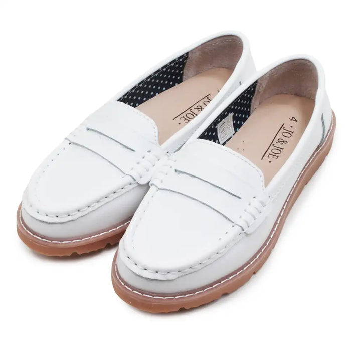 White loafers with brown soles on a white background