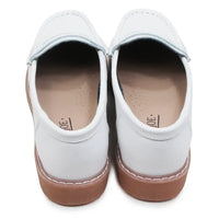 White loafers with brown soles on a white background
