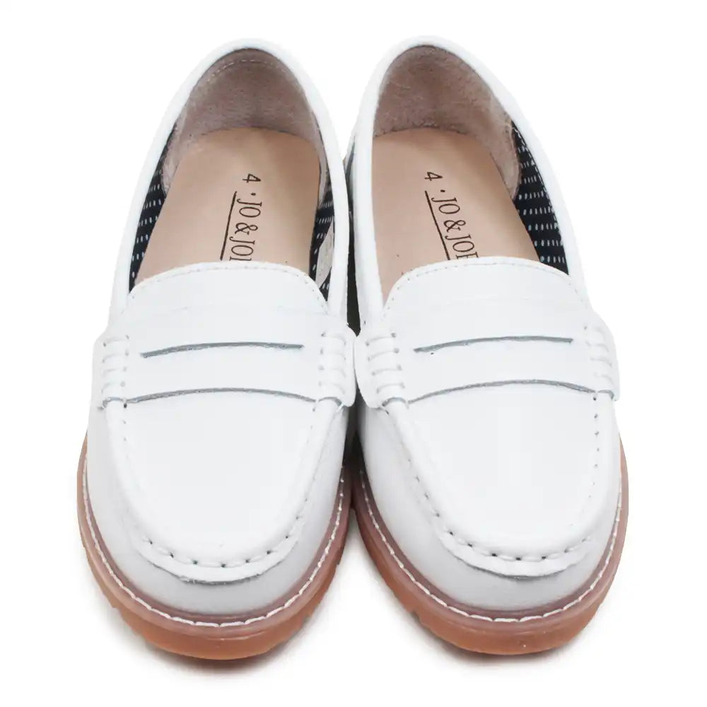 White loafers with brown soles on a white background