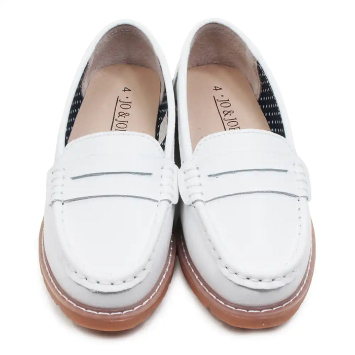White loafers with brown soles on a white background